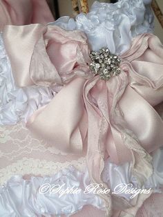 a pink and white wedding garter on a chair