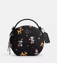 Product Details Printed coated canvas and smooth leather Two credit card slots Double zip closure, fabric lining Top handle with 1 1/4" drop Detachable strap with 23 1/4" drop for shoulder or crossbody wear 6 3/4" (L) x 6" (H) x 2 1/2" (W) Disney x Coach ©Disney Style No. CM846 Disney Christmas Outfits, Lounge Fly, Disney Purses, Disney Apparel, Disney Purse, Disney Merch, Disney Bags, Bag Obsession