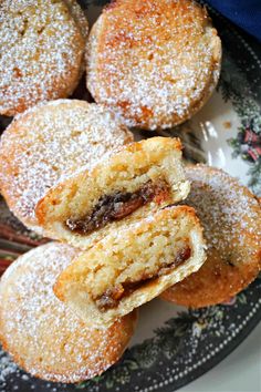 powdered sugar filled pastries on a plate