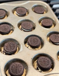 an oreo cookie in a muffin tin on top of a stove burner