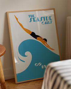 an advertisement for the seaside calls is displayed in a room with a bed and chair