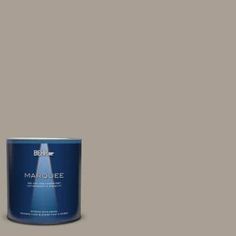 a white paint can with the words marjoie on it and a blue tin