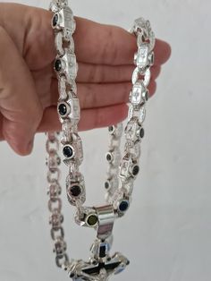 The men's chain is made of 925 sterling silver with black onyx inlays. Completely handmade at all stages of production. Absolute exclusive. At the request of the buyer, the product is available in blackened form with stones of different colors. The weight of the necklace is 170-200 grams, the width of the link is 9.2 mm., The onyx stone is 5 mm. Attention The necklace ships without a cross. Photo of a chain with a cross for example. Luxury Custom Silver Necklace With Polished Finish, Luxury Hallmarked Silver Custom Necklace, Black Sterling Silver Link Necklace, Cross Photo, Mens Necklace Pendant, Mens Silver Jewelry, Mens Bracelet Silver, Mens Silver Necklace, Men Diamond Ring