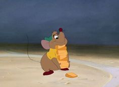 a cartoon mouse holding a large piece of bread in it's hand on the beach