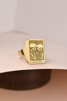 Welcome to LUXJ, Here you will find a beautiful selection of rectangle signet rings with a variety of designs such as our lovers tarot card signet ring. Our team is happy to assist you with any questions you may have and we look forward to creating these special jewelry for you. *The images are taken from us and you will receive your ring as shown* | Information about the ring | - Face Size: 16x12mm - Band width at the bottom: 3mm | Material | - Sterling Silver 925 - Gold Vermail (925 base) - 9K Real Gold (375) - 14K Real Gold (585) - 18K Real Gold (750) Your ring will include a hallmark which certifies its material. For an additional certification of authenticity, please contact us! | Shipping | - DHL Express or FedEx - Handling time: 3-5 business days - Shipping time: 3-5 business days Y Adjustable Rectangular Signet Ring As Gift, Adjustable Rectangular Signet Ring Gift, Holding A Rose, Signet Ring For Men, Lovers Tarot Card, Women Skeleton, The Ring Face, Signet Rings, Etsy Gold Ring