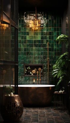 a bath tub sitting next to a green tiled wall