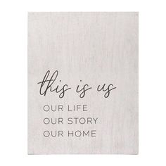 this is us our life our story our home written on a piece of white wood