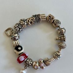 Authentic Pandora Bracelet W/18 Rare & Retired Charms & Spacers Excellent Condition, 7" Long Spacer Bead Christmas Tree 14k Crown 925 Sterling Retired Rare Everlasting Love Rosebud Retired Rare Wrapped Christmas Present Retired Spacer Feather Rare Retired Cz Charm Sterling Silver With 14k Gold Lucky Clover Irish Shamrock Bead Cz Swirl Be My Valentine Sterling Silver Heart Pink Cz Charm Snowflake Charm Aqua Cz Rare Retired Spacer Yin Yang Charm Enamel With Cubic Zirconia Charm Retired Pandora Simple Flower Pearl Charm Bead Rare Retired Loveyou Pink Enamel Heart Ale Pink Opal Cabochon Spacer Charm Spacer Pink Sterling Silver Jubilee Bracelet, White Beaded Charms Bracelets, Bead Christmas Tree, Yin Yang Charm, Irish Shamrock, Simple Flower, Jewelry Fashion Trends, Lucky Clover, Jewelry Lookbook