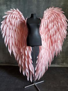 a mannequin with pink wings on it