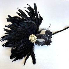 black lace mask with feathers, black feather mask, black masquerade masks women, masks with feather for women Great conversation piece! Hanging Wall art! S H I P P I N G - Last minute masquerade mask shopping? Processed same day or within 24 hours. 1-2 day guaranteed delivery services offered, add items to cart and click on shipping tab for rates. Pls leave a check out note with your need date & contact number (especially for expedited and custom orders) Msg for delivery time frames (Include Elegant Feathered Eye Mask For Masquerade, Black Feathered Masquerade Mask, Black Feathered Masquerade Mask For Costume Party, Black Masquerade Mask Women, Black Lace Mask, Mask With Feathers, Masquerade Mask Women, Elegant Face Mask, Black Masquerade