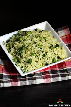 a white bowl filled with rice and vegetables