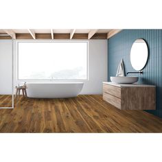 a bathroom with wood flooring and a bathtub in the middle of the room