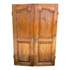 an old wooden armoire with two doors on one side and another in the other