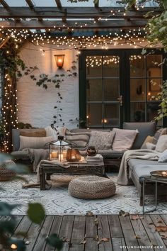 an outdoor living area with lights and furniture