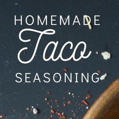 homemade taco seasoning in a wooden spoon with text overlay that reads homemade taco seasoning