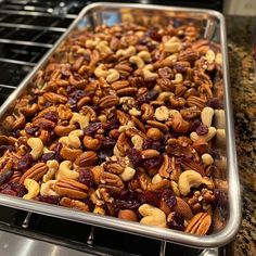 nuts and cranberries are being cooked in the oven