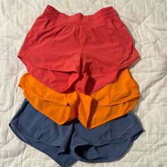 Set Of Three Lululemon Hotty Hot High Rise Shorts, 2.5 Inch Inseam. Size 4. Bought From Lululemon Website, Each Pair Worn 1-2 Times. Hot Pink, Orange And Blue. *These Shorts Have Been Sold, Poshmark Keeps Duplicating My Listings For Some Reason And Not Letting Me Delete Anything. These Are No Longer Available!* Red Lululemon Shorts, Lululemon Poshmark, Lululemon Shorts, High Rise Shorts, Shorts Athletic, Athletic Shorts, Pink Orange, Lululemon Athletica, Hot Pink