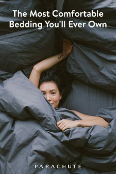 a woman is laying in bed with her head under the covers and text that reads, the most comfortable bedding you'll ever own