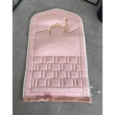 a large pink mat with an image of a house on it