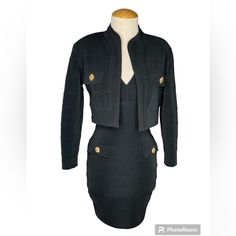 Experience A Blast From The Past With This Vintage Sexy Bandage Bodycon Dress, Complete With A Cropped Bolero Jacket. The Dress Is Made With Stretchy Material And Has A Body-Hugging Fit That Accentuates Your Curves Perfectly. The Jacket Provides A Touch Of Elegance And Sophistication To The Outfit. Available In Classic Black, This Dress Is Perfect For Any Occasion Or Theme, Especially If You're Going For That 80s Vibe. Omg This Dress Is Beyond Sexy! A Complete Head Turner! The Pictures Does It No Justice! Minimum Stretch Measurements: Bust:34.5/35” Waist:28.5” Length:26” Jacket: Sleeve:21.5” Pit-Pit: 17” Length: 15.2” Double-breasted Fitted Blazer Dress With Gold Buttons, Elegant Black Single-breasted Cropped Jacket, Black Rhinestoned Long Sleeve Outerwear, Black Knee-length Blazer Dress With Button Closure, 80s Vibes, Bandage Dress Bodycon, Bolero Jacket, Blast From The Past, Stretchy Material