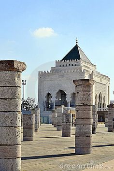 an old building with columns in front of it