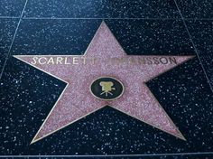 the star on the hollywood walk of fame is shown in black and gold with an inscription that reads, scarlet robinson