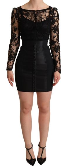 Explore timeless elegance and Italian craftsmanship with this stunning, brand new piece by Dolce & Gabbana. A vision in black, this fitted mini-dress captivates with its illusion of a long-sleeve lace top over a sleek bodysuit, fastened with hidden hooks. The rear zipper closure ensures a seamless silhouette, while the silk stretch lining offers luxurious comfort. It’s a statement garment that signifies exclusivity and exquisite workmanship. Color: Black Material: 52% Nylon, 30% Cotton, 8% Elast Fitted Lace Top, Top In Pizzo, High Heel Stiefel, Black Lace Corset, Black Lace Mini Dress, Model Looks, Dolce Gabbana Dress, Corset Mini Dress, Fitted Mini Dress