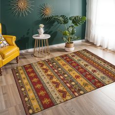 a living room with a yellow chair and rug in front of a green painted wall