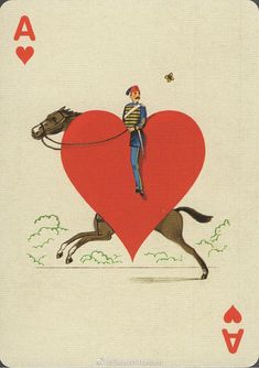 a man riding on the back of a horse in front of a heart shaped card