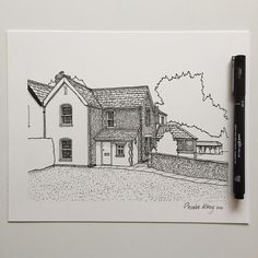 a pen drawing of a house on paper