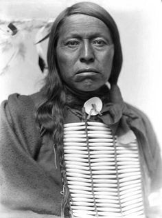 an old black and white photo of a native american woman