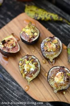 stuffed eggplant on a wooden cutting board with peanut butter and other toppings