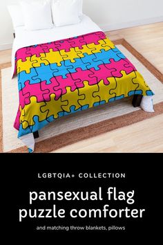 a bed covered in a colorful puzzle piece comforter