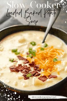 a bowl of loaded baked potato soup with cheese and green onions on top, topped with bacon