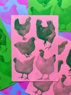 four different colored hens on pink, green and purple paper with black ink in them