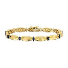 This stunning blue sapphire and 10K gold bracelet will add a touch of elegance to any outfit. 10K gold. Bracelet features solid cinched oval-shaped links joined by 4 x 2.0mm marquise-cut blue sapphire stations. 7.25-inch bracelet secures with a box clasp. Navy And Gold Jewelry, Classic Sapphire Bracelets For Anniversary, Classic Blue Round Gold Bracelet, Classic Blue Gold Bracelet, Classic 14k Gold Gemstone Tennis Bracelet, Classic 14k Gold Tennis Bracelet With Gemstones, Yellow Gold Sapphire Tennis Bracelet For Formal, Yellow Gold Sapphire Tennis Bracelet For Formal Occasions, Formal Sapphire Tennis Bracelet In Yellow Gold