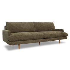 a brown couch sitting on top of a white floor