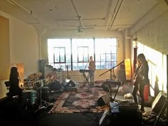 a group of people playing instruments in a room