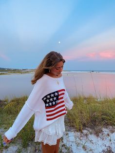 Show your patriotic pride in the Land of Free White Oversized Flag Sweater! White knit fabric forms a boat neck sweater that can be worn or slouchy off-the-shoulder. Preppy flag sweater with oversized bodice with drop shoulders and long sleeves. Features alternate crochet knit with American flag design. Style over your favorite jeans for an effortlessly cute and casual look! DETAILS & FIT 100% Cotton. Machine Wash Cold. Imported. ORDERS, SHIPPING & RETURNS Orders, Shipping, & Returns . Preppy Pullover, American Sweater, Flag Sweater, Boat Neck Sweater, American Flag Sweater, American Flag Design, Cali Girl, Illustration Fashion Design, Boatneck Sweater