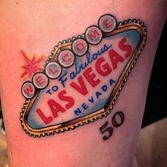 the las vegas sign has been tattooed on someone's leg for some reason,