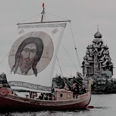 a boat with a painting on it floating in the water