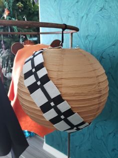 a paper ball hanging from a clothes rack