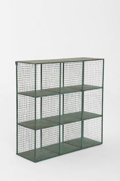 a green shelf with four shelves on each side and three wire sections in the middle