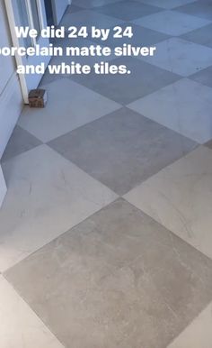 the floor is covered in white tiles and boxes