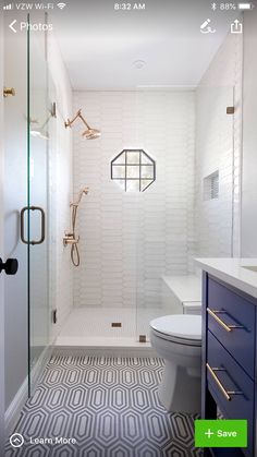 a white and blue bathroom with an open shower