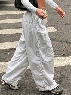 ⚡Buy 2023 Low Waist Baggy Wide Leg Cargo Pants White M under $38.00 in Pants at AnotherChill.com Online. Style: Casual/Street/Punk/Hip Pop/Grunge/Y2K. Fabric Content: Polyester, Spandex. Fit Type: Relax fit. : Get ready to rock your street-style game with these size-friendly parachute cargo pants. Designed for comfort and versatility, these pants feature a relaxed silhouette and a low waist that flatters your figure. The elasticated waist ensures a comfortable fit, while the functional pockets p Celana Kargo, Hip Hop Trousers, Pink Cargo Pants, Y2k Cargo Pants, Streetwear Cargo Pants, Celana Fashion, Cargo Pants Streetwear, Y2k Pants, Baggy Cargo Pants