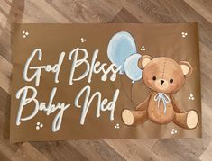 a brown teddy bear with blue balloons and the words god b is for baby ned