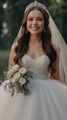 a woman in a wedding dress is smiling at the camera and wearing a tiara