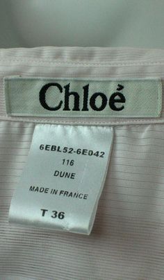 label on the back of a white shirt that says,'chloe gerls - 66