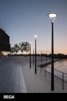 there are many lights along the water side